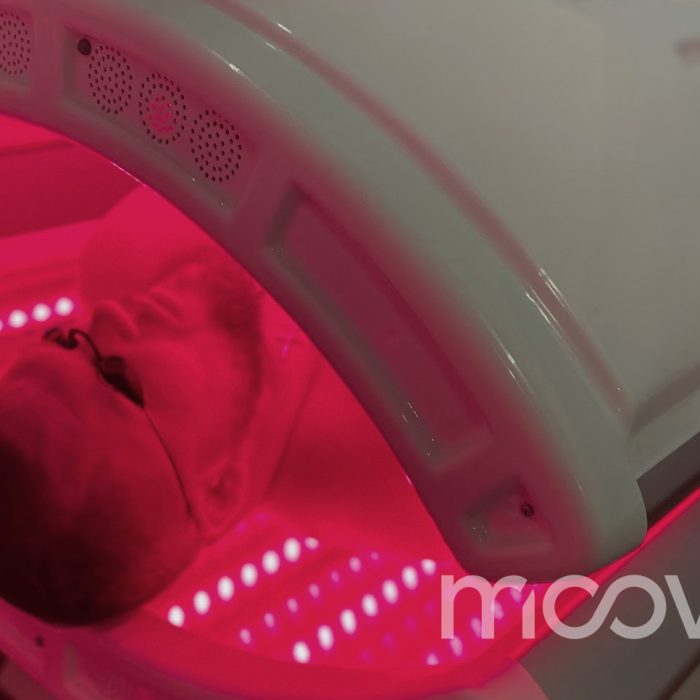 Red Light Bed Therapy in Orlando, FL at Moov Labs Man relaxing under red light therapy bed at Moov Labs in Orlando, Florida, promoting inflammation reduction and full-body recovery.